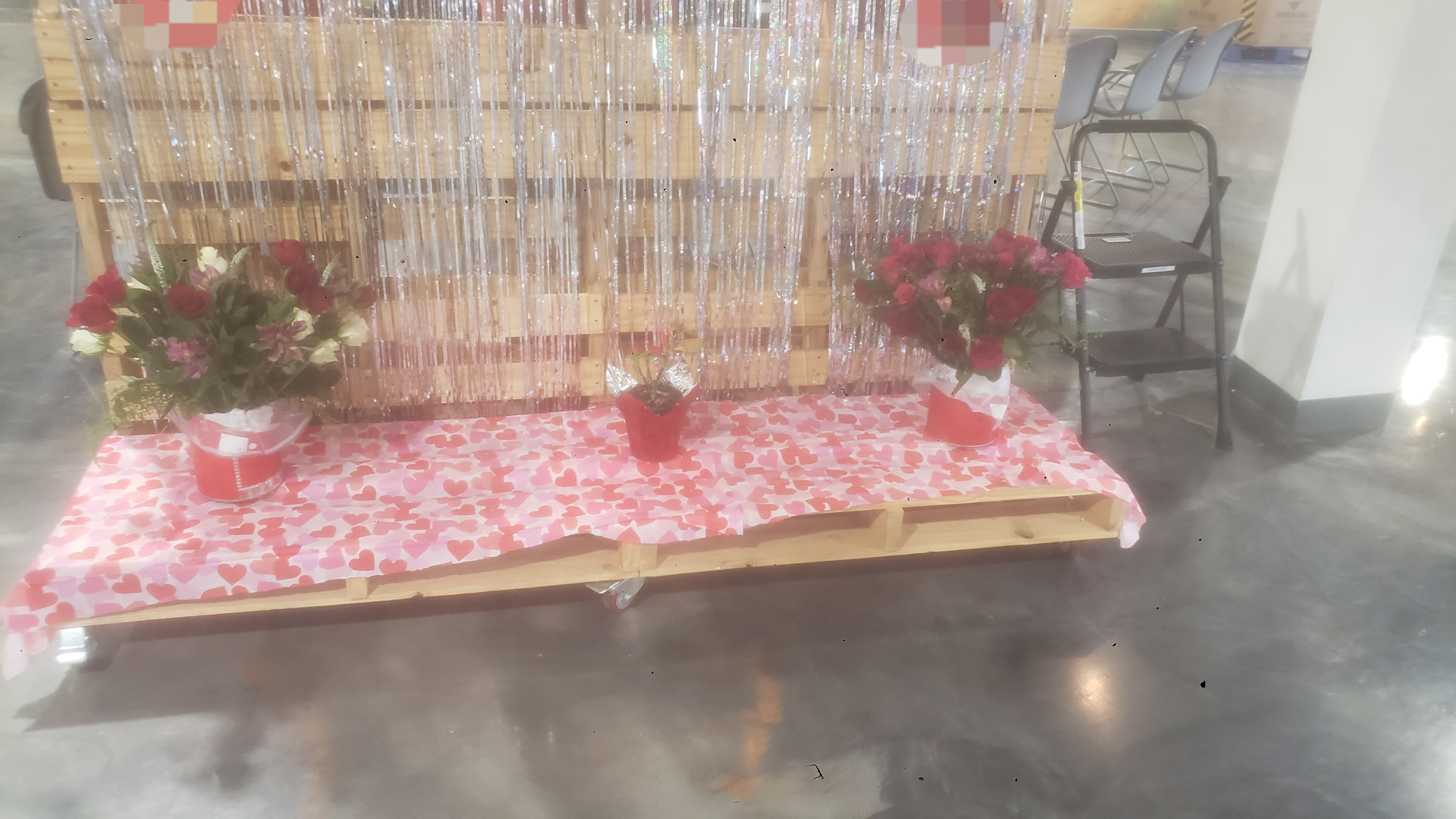 Two flower bouqets on heart table runner for a valetine display.